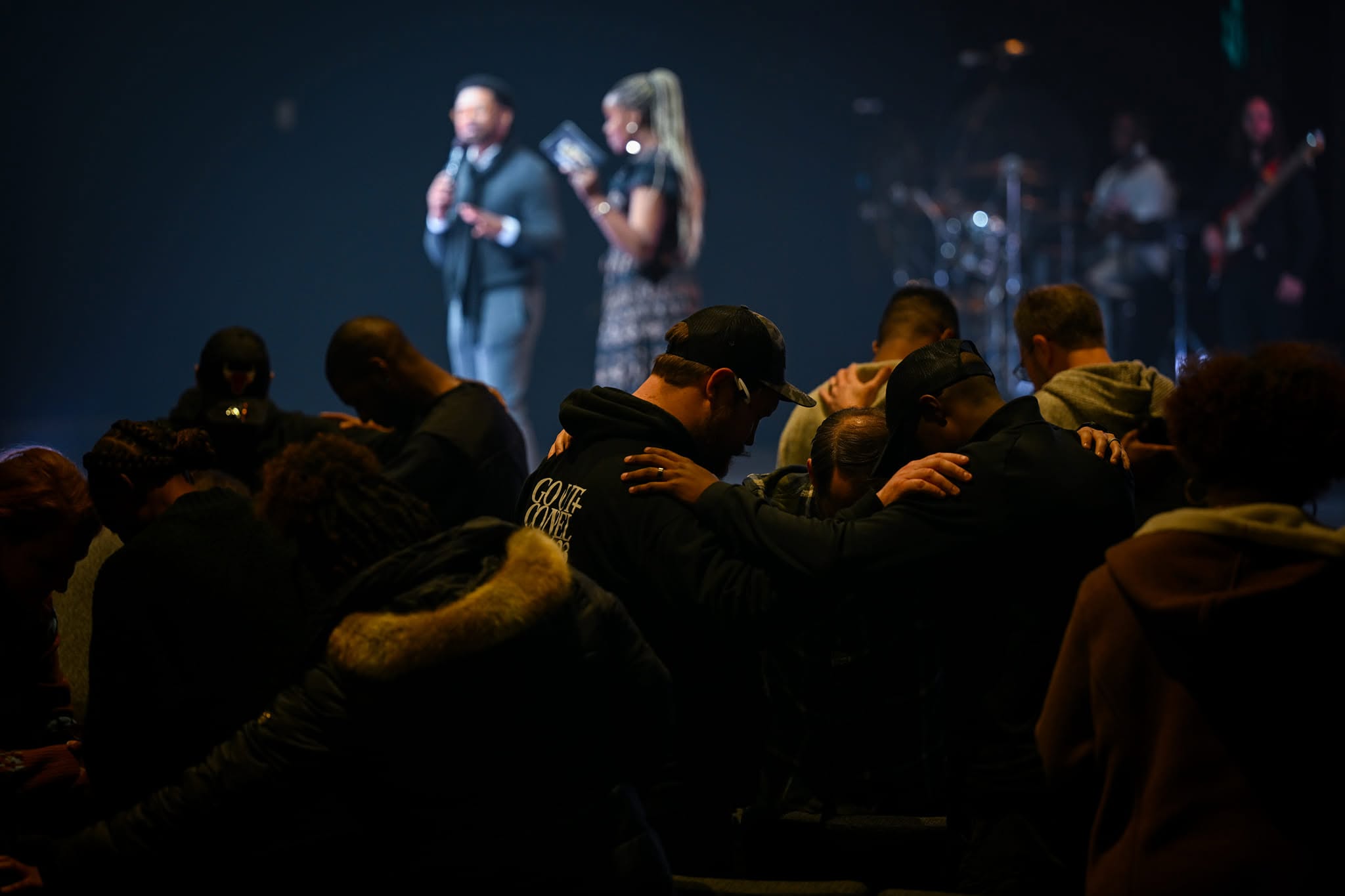 Atlanta Church Creatives members praying together during a worship gathering