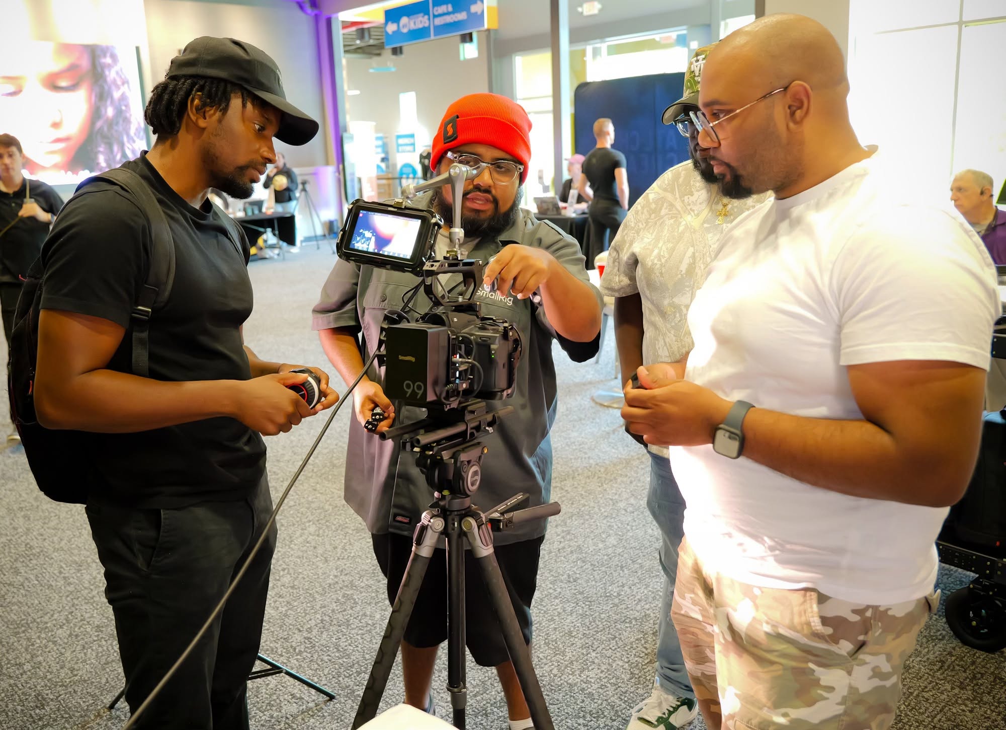 Church creatives learning together around a professional cinema camera