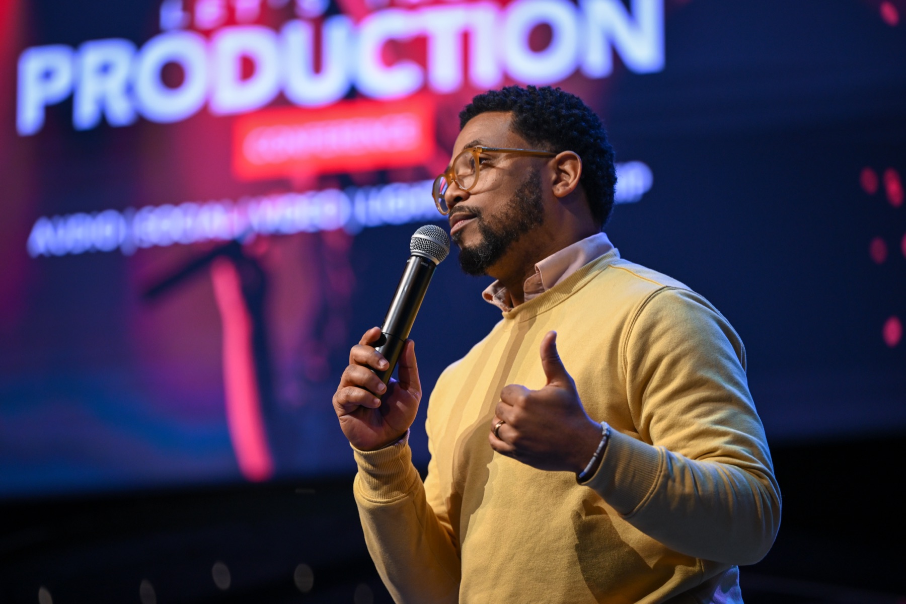 A speaker sharing at the Let’s Talk Production conference